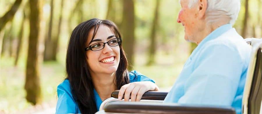 Female HHA and patient in wheelchair